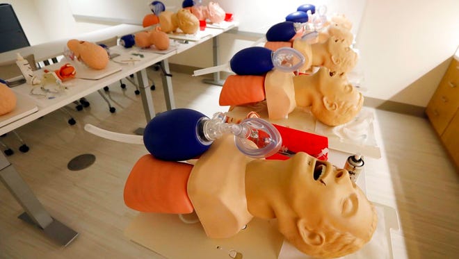 In this Friday, Aug. 4, 2017 file photo, mannequins are arranged to train CPR to incoming medical students in Jackson, Miss.