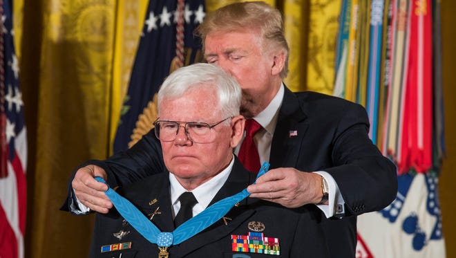 President Trump awards the Medal of Honor to U.S. Army Capt. (Ret.) Gary M. Rose for 'conspicuous gallantry during the Vietnam War' in the East Room of the White House Monday.