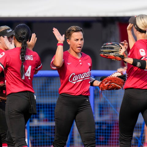 Canadian players celebrate during the softball gam