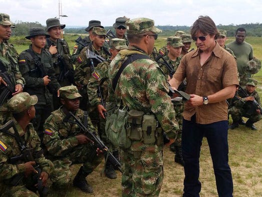 Tom Cruise speaks with a group of soldiers of the Colombian