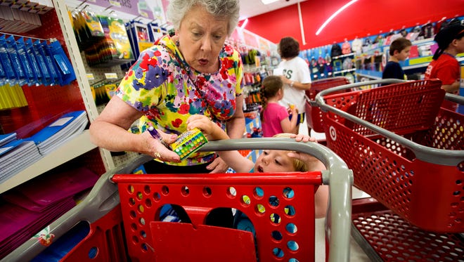 Julie Wilkins shops with her grandson, Griffin Brady, 3, at a Target in Memphis during last year's back-to-school season.