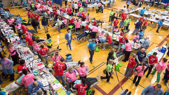 The gymnasium floor is filled with patients and volunteers during the first ever Mid-South Mission of Mercy free dental clinic at Bellevue Baptist Church on Feb. 26, 2016. As many as 2,500 patients will receive $1.5 million in free dental care. Lines began forming before sunrise for the first-come, first-served event with 1,200 wristbands for services being handed out before 7am. There are no eligibility requirements and patients can receive services including cleanings, fillings and extractions from members of the Tennessee, Mississippi, and Arkansas Dental Associations. More than 1,600 volunteers from dentists and hygienists to musicians and spiritual supporters helped make the event possible. Mid-South Mission of Mercy continues at Bellevue Baptist Church Saturday, February 26th with doors opening at 6am. (Brandon Dill/Special to The Commercial Appeal)