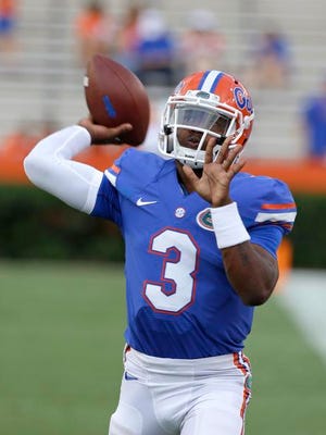 FILE - In this Sept. 13, 2014, file photo, Florida freshman quarterback Treon Harris (3) warms up prior to an NCAA college football game against Kentucky in Gainesville, Fla. Harris has been suspended while he is being investigated for sexual assault. The school says Harris is accused of sexually assaulting a female student early Sunday, Oct. 5, 2014, hours after Harris helped Florida rally to beat Tennessee 10-9 in Knoxville, in a residence hall on campus in Gainesville, Fla. (AP Photo/John Raoux, File)