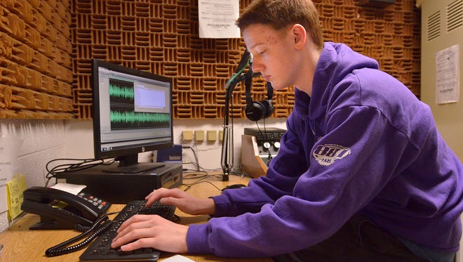 WSDP FM staffer Ian Kandt edits an overnight broadcast.