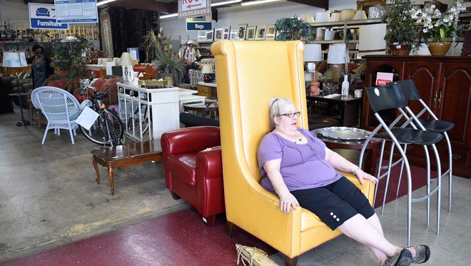 Judith Eklond, a former Nashvillian now living in Cairo, Ill., checks out a chair at the Habitat for Humanity ReStore at 1008 Eighth Ave. on Tuesday in Nashville.