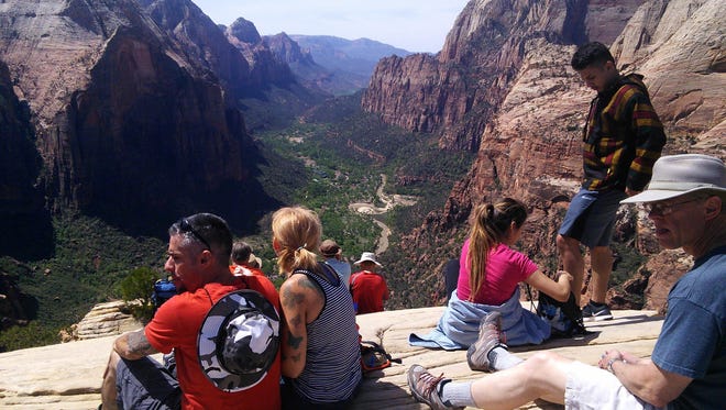 Hikers enjoy the trail to the top of Angels Landing in Zion National Park Thursday, April 21, 2016. All week, entrance fees have been waived at the national parks, including Zion, to commemorate National Parks Week. Entrance fees will continue to be waived through the weekend.