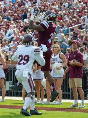 Devonta Jason catches the ball for the maroon team during the annual Maroon and White game at Davis Wade Stadium on the Campus of Mississippi State University on April 21, 2018.