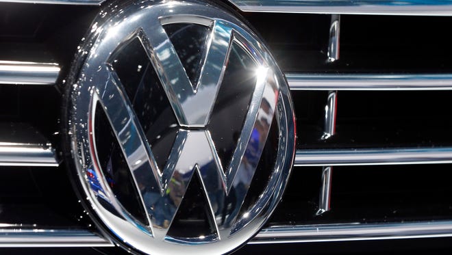 In this Sept. 22, 2015, photo, the Volkswagen logo is seen on a car during the Car Show in Frankfurt, Germany. Volkswagen’s plan to fix most of its 2-liter diesel engines that cheat on emissions tests includes a computer software update and a larger catalytic converter to trap harmful nitrogen oxide, according to dealers who were briefed by executives on the matter.