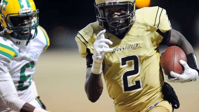 Bassfield's Jamal Peters gets past Taylorsville's Devin Ducksworth during their game Friday night at Bassfield.