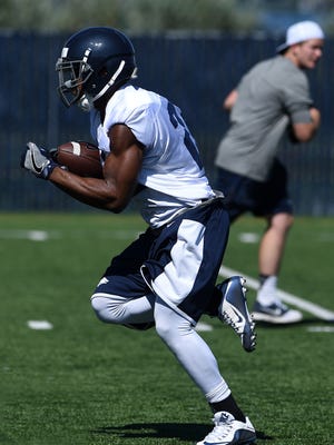 Nevada running back Akeel Lynch runs up field during the Wolf Pack's first fall camp practice last Saturday.