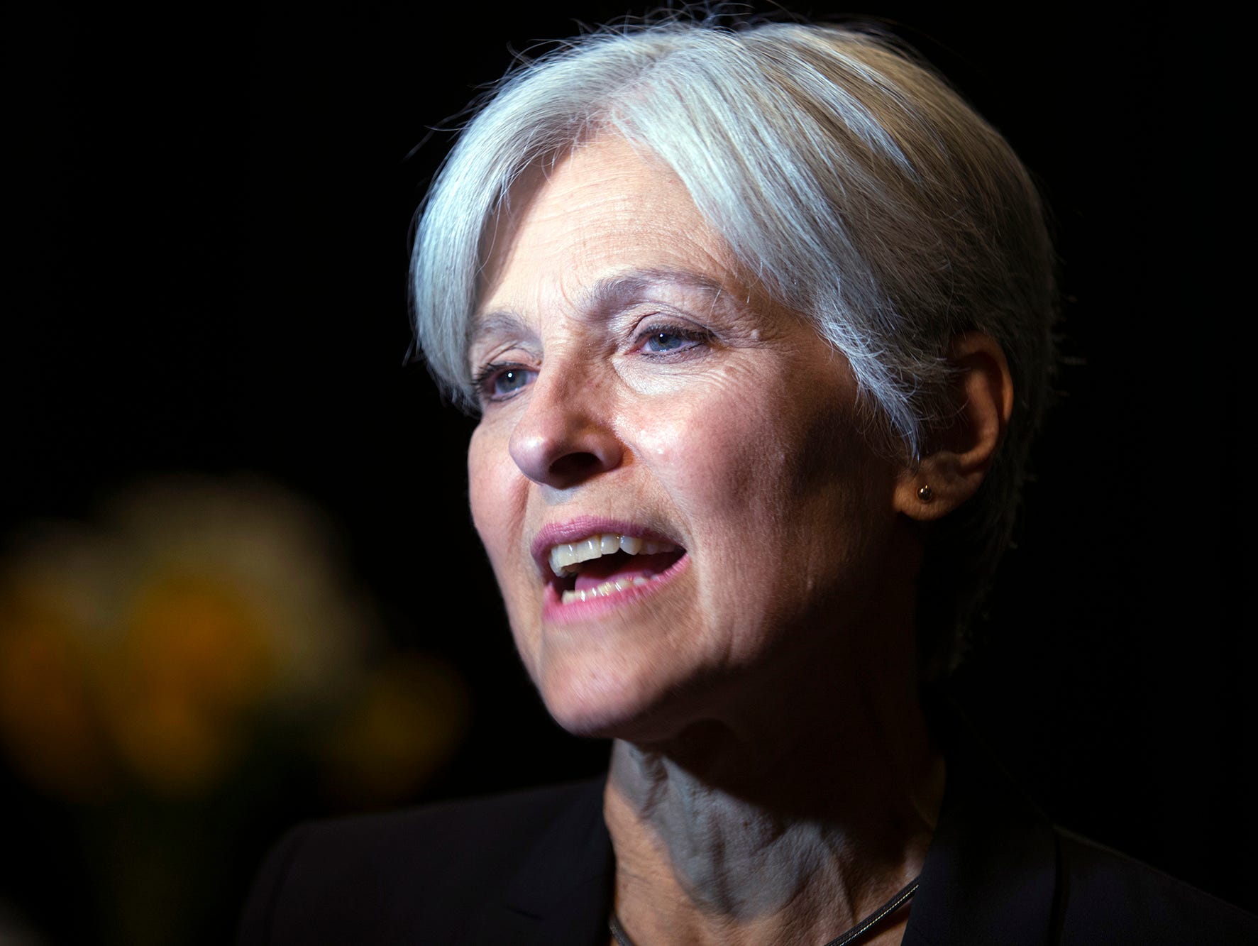 In this Oct. 6, 2016, file photo, Green party presidential candidate Jill Stein meets her supporters during a campaign stop at Humanist Hall in Oakland, Calif. A federal judge early on the morning of Monday, Dec. 5, 2016, ordered a recount of Michiga