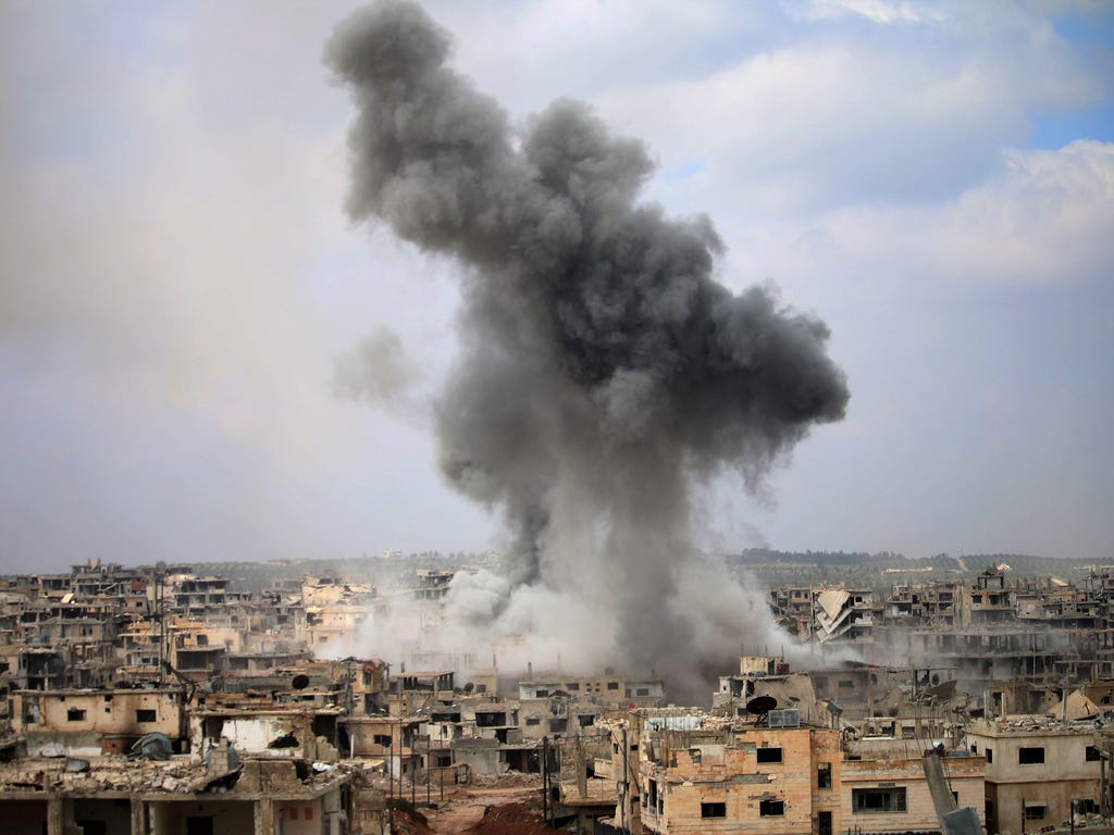 Smoke billows following a reported air strike on a rebel-held area in the southern Syrian city of Daraa.