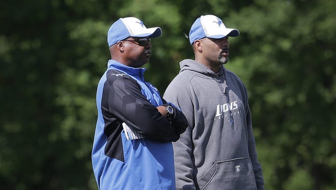 Detroit Lions head coach Jim Caldwell, left, talks with defensive coordinator Teryl Austin on June 3, 2014.