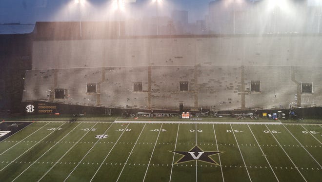 Rain pours down during the weather delay in the game between Vanderbilt and MTSU at Dudley Field Saturday Sept. 10, 2016, in Nashville, Tenn.