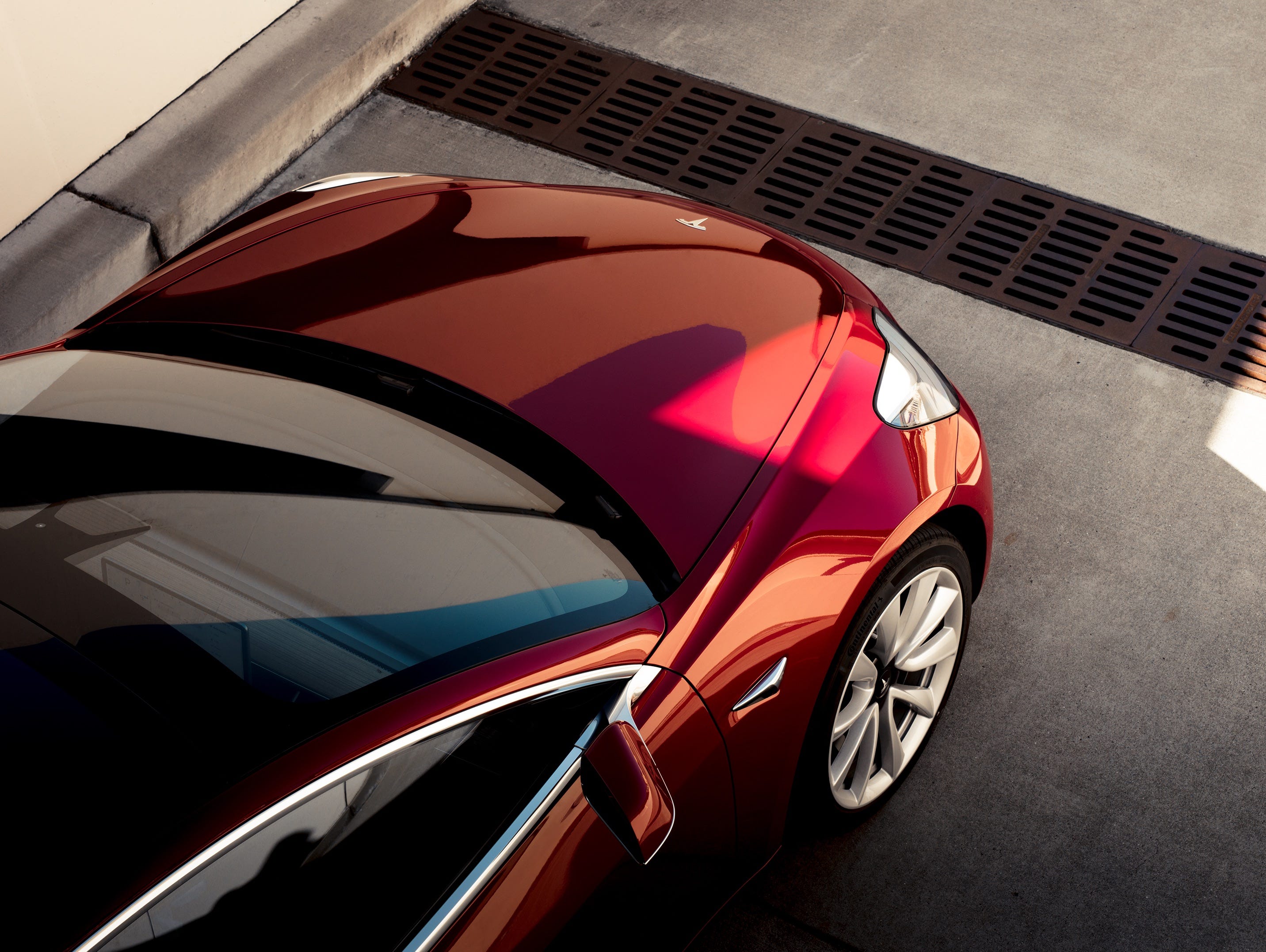 The Tesla Model 3 takes many of its stylistic cues from its larger sibling, the Model S sedan.
