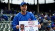 NLDS Game 4: Nationals at Cubs - A fan holds a sign