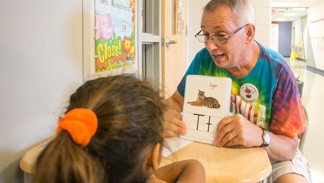 Tutor Alan Dubs, works with first grader Xiomariz Garcia, 6, on her alphabet memorization Tuesday, Sept. 6, 2016, at Arthur W. Ferguson School, in York City. Amanda J. Cain photo