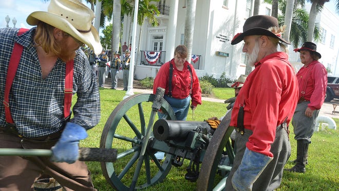 File: Confederate reenactors fire artillery during the Everglades City Fourth of July celebration.
