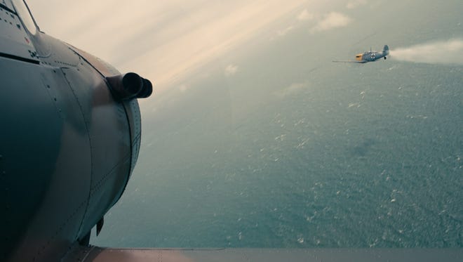 A British Spitfire hits its target during a dogfight scene in 'Dunkirk.' The scene was shot with an IMAX camera mounted onto the side of a plane.