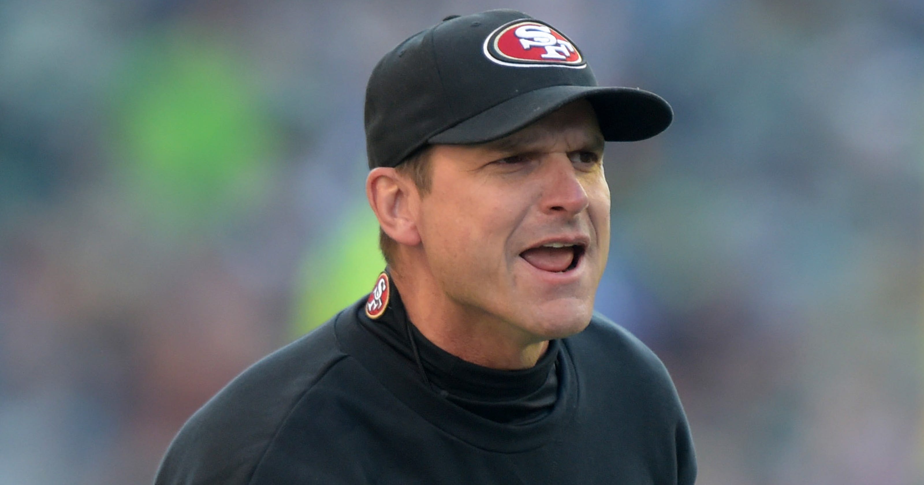 Report Jim Harbaugh to coach Michigan football
