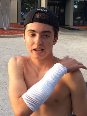Zack Davis, 16, talks Wednesday evening outside Lawnwood