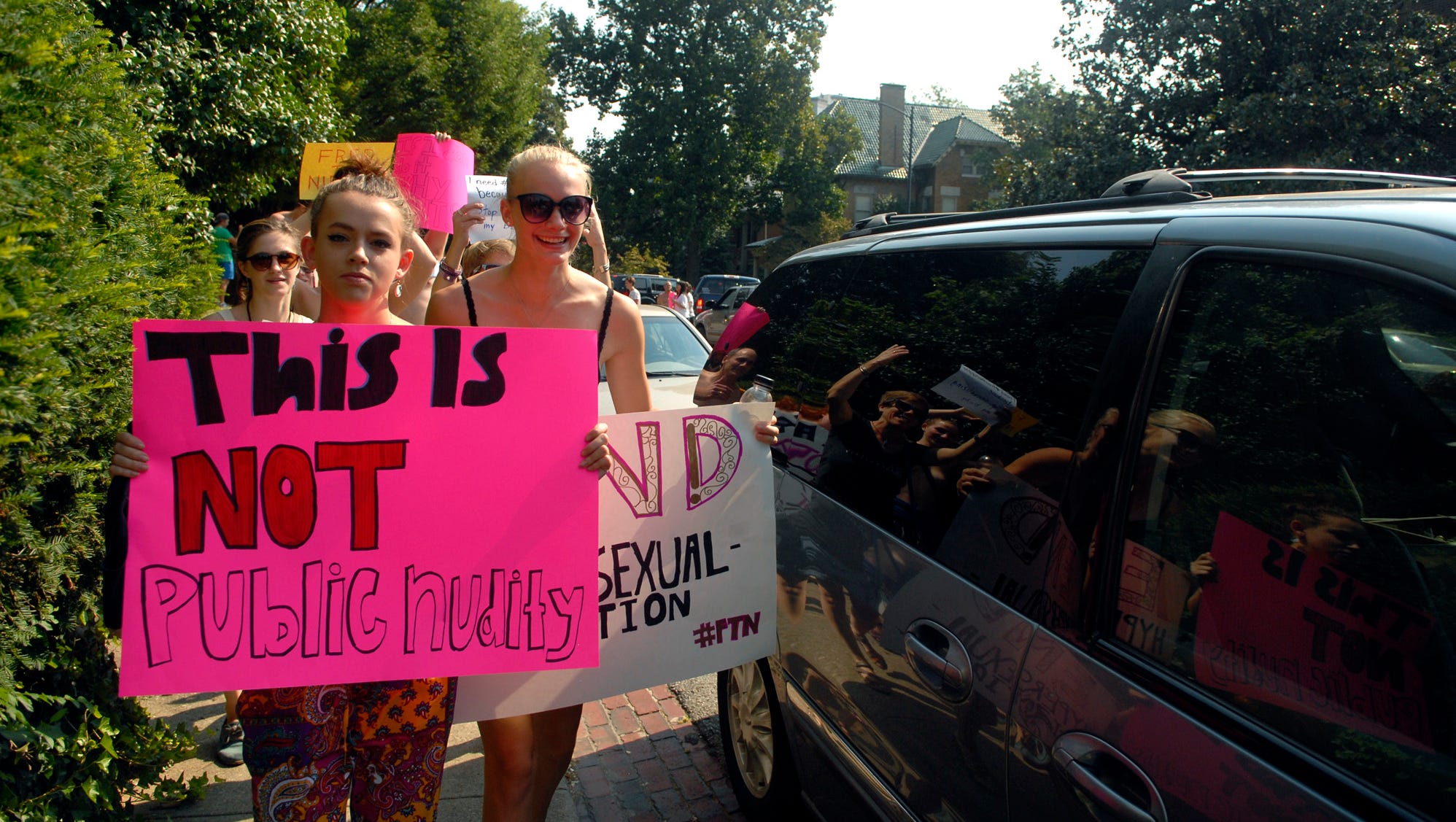 Women go topless for FreetheNipple walk