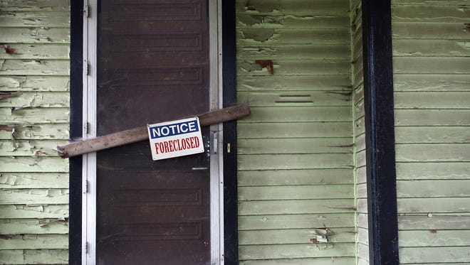 Old vacant house with Foreclosed notice on door