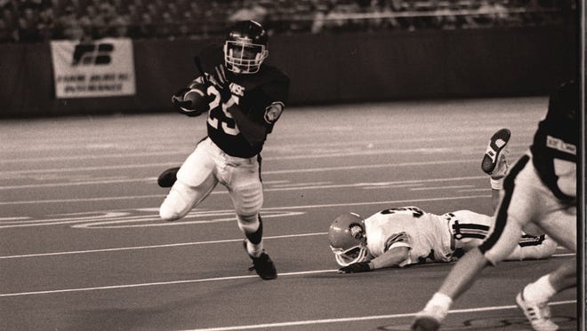 East Lansing's Randy Kinder helped the Trojans defeat Birmingham Brother Rice, 14-0, in the 1991 Class A state football championship game at the Pontiac Silverdome.