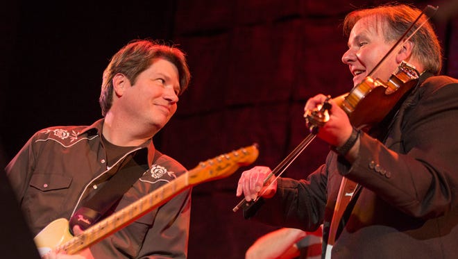 Ken Herblin (left) and David Poland perform at least year’s Shine a Light concert at World Cafe Live at the Queen.