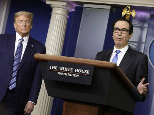 Treasury Secretary Steve Mnuchin, right, speaks next to President Donald Trump during a Coronavirus Task Force news briefing in April at the White House. Attempts by the Small Business Administration and the Treasury Department to effectively shame public companies into returning paycheck protection loans of more than $2 million by May 18 had mixed success.
