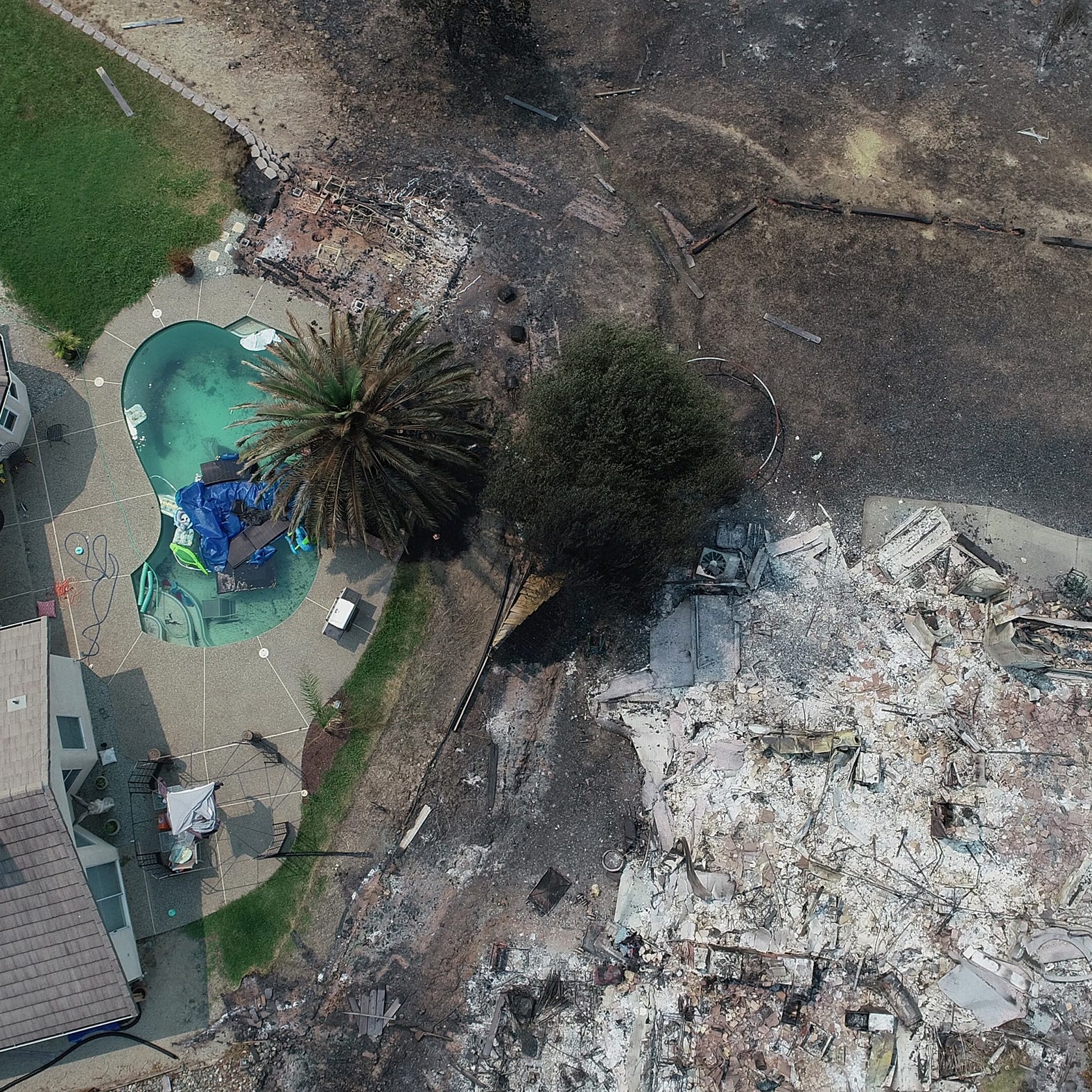 Homes in the River Ridge Park subdivision show the damage from the Carr Fire. This home at 3492 Showboat Ct. is completely destroyed in Redding Calif.