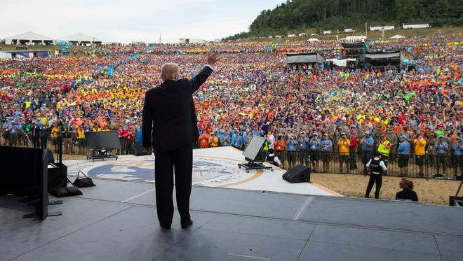 In this Monday, July 24, 2017 file photo, President Donald Trump waves to the crowd after speaking at the 2017 National Scout Jamboree in Glen Jean, W.Va.