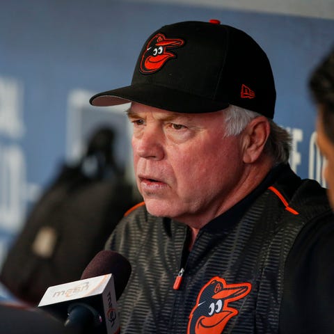 Baltimore Orioles manager Buck Showalter (26) answ