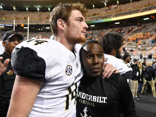 Vanderbilt Head Coach Derek Mason hugs Vanderbilt quarterback