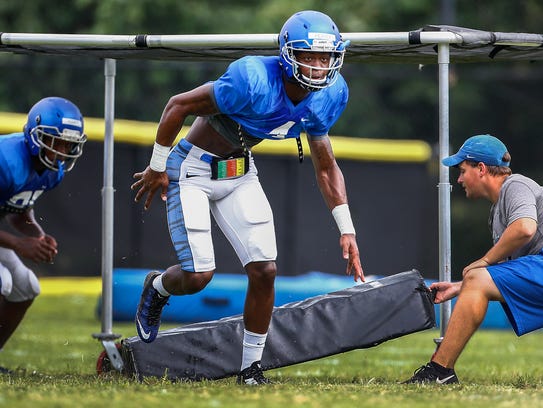 University of Memphis defensive back Josh Perry (middle)