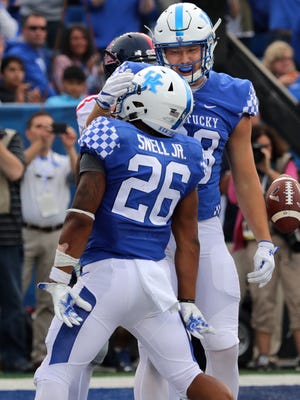 Kentucky's Benny Snell Jr. and Justin Rigg celebrate after Snell powered in for a touchdown against Ole Miss. 