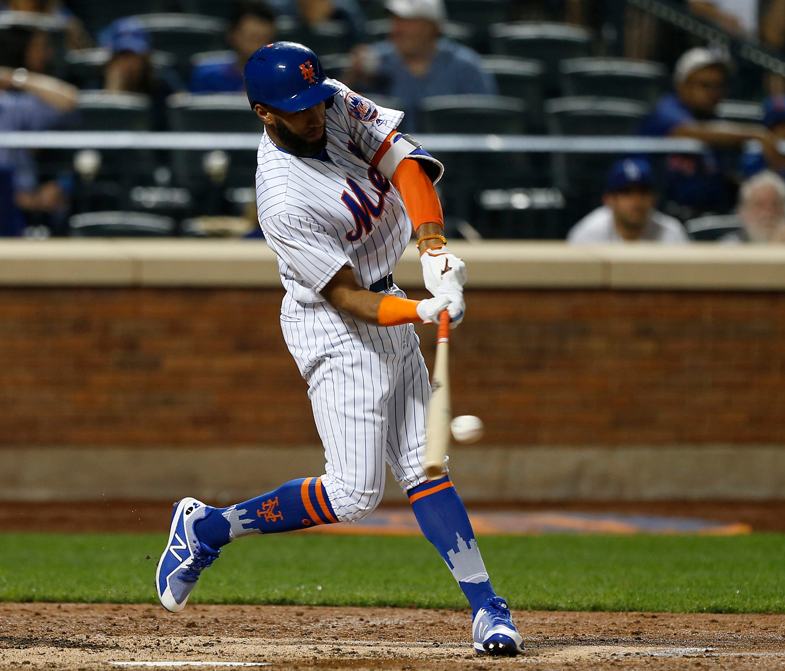 Mets shortstop Amed Rosario hits a single in the fifth inning against the Los Angeles Dodgers at Citi Field on Friday.