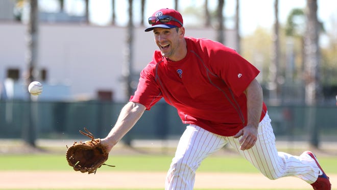 Feb 19, 2015; Clearwater, FL, USA; Philadelphia Phillies starting pitcher Cliff Lee (33) fields a ball during spring training workouts at Bright House Field. Mandatory Credit: Reinhold Matay-USA TODAY Sports