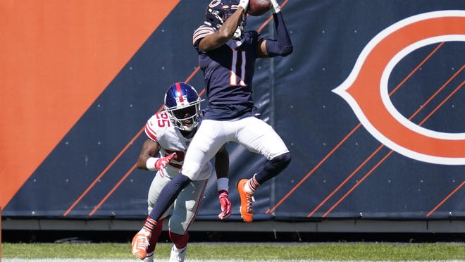 Chicago Bears wide receiver Darnell Mooney (11) catches a 15-yard touchdown pass during the first half in Chicago, Sunday.