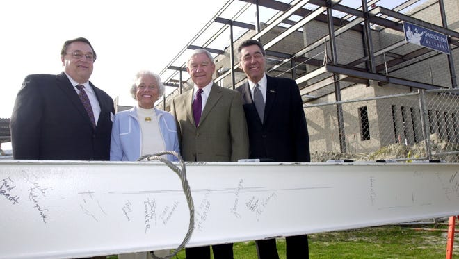 CSUSB President Emeritus Al Karnig (right), who died Thursday, is pictured here with Fred Jandt, Betty Baker and Dick Oliphant as the last steel girder for the new Cal State San Bernardino Palm Desert Campus is put in place. Desert Sun file photo 2004