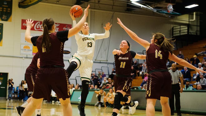 Catamount forward Kristina White (13) leaps to take a shot during the women's basketball game between the Norwich Cadets and the Vermont Catamounts at Patrick Gym on Wednesday night November 15, 2017 in Burlington.