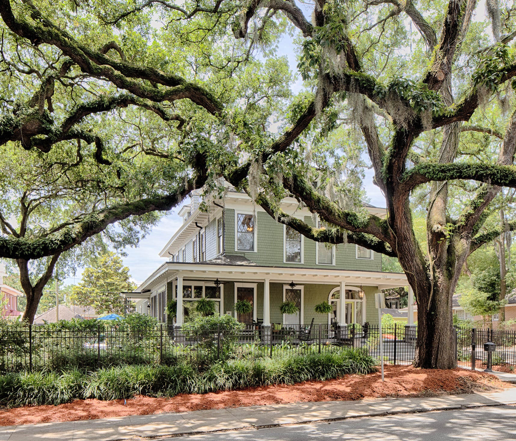 This Ardsley Park Victorian mansion, built circa 1913 and located at 121 E. Victory Drive, is listed in Savannah, Georgia, for $849,000. It has an expansive front porch, seven bedrooms and five bathrooms, eight fireplaces, an elevator, and a swimming