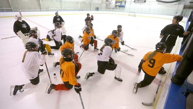 Bishop Kearney head coach Chris Baudo explains a drill to his girls hockey team during a recent practice at the Bill Gray's Regional Iceplex. The first-year program is off to a fast start.