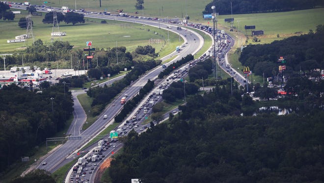 Traffic backs up Sept. 7, 2017, on northbound Interstate 75 at its intersection with the Florida Turnpike as residents flee Hurricane Irma.