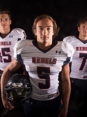 West High School football players Noah Hoxie, Nathan Cottrell, and Seth Marshall, from left, pose for a portrait in the Knoxville News Sentinel studio in Knoxville on Wednesday, July 9, 2014.