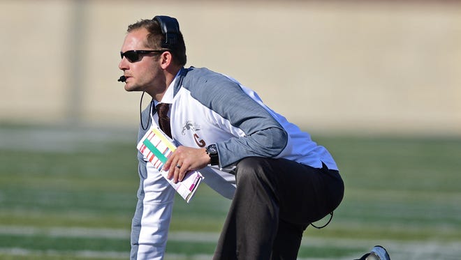 Western Michigan head coach P.J. Fleck watches from the sideline in the first quarter of Saturday's game against Akron .