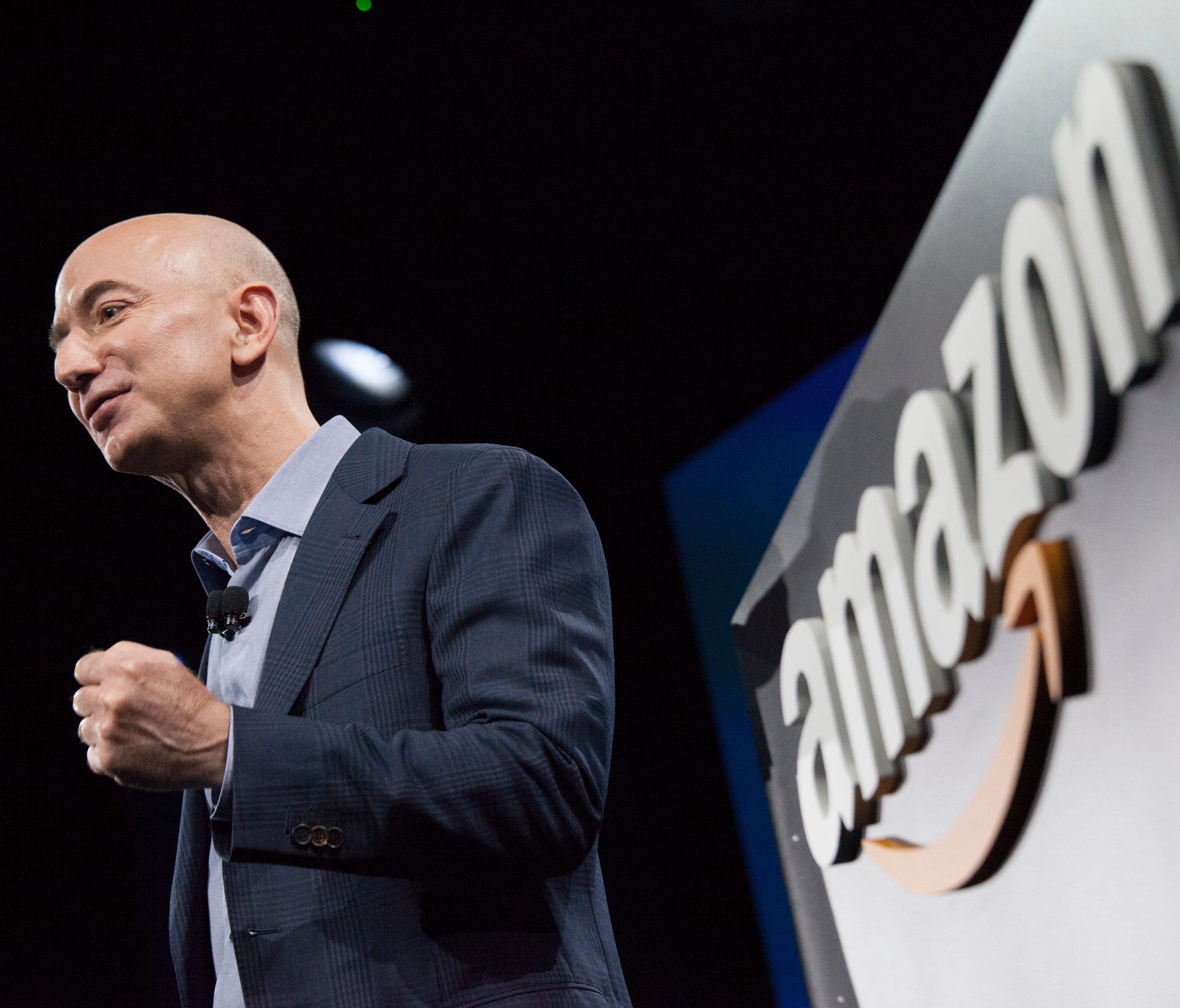 Amazon.com founder and CEO Jeff Bezos presents the company's first smartphone, the Fire Phone, on June 18, 2014 in Seattle. On June 16, 2017, Amazon announced it was purchasing Whole Foods.