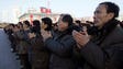 North Koreans clap in a rally, after North Korea said