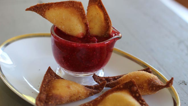 Fried sweet cheese and almond dumplings combine oil and cheese for a perfect Hanukkah treat.