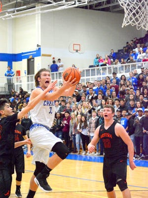 Carlsbad's Brenden Boatwright attacks the basket in the first quarter Tuesday.